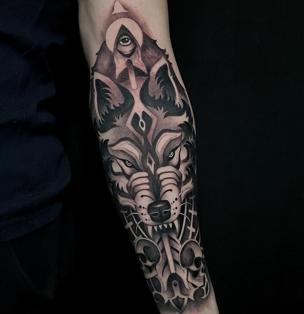 Angry lone wolf forearm tattoos for men