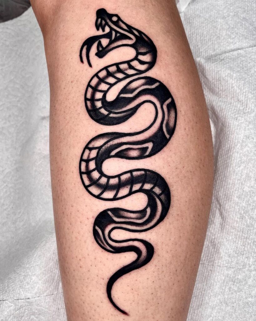 Angry snake tattoo lower leg back calf