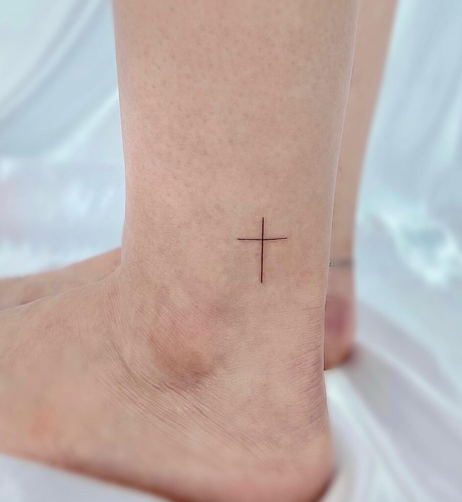 Ankle adornment mini cross tattoo with style