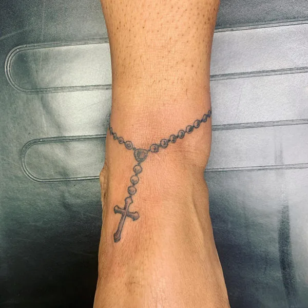 Ankle bracelet tattoos with cross
