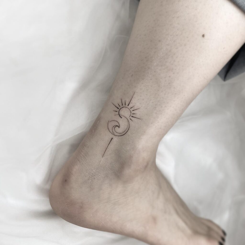 Ankle lower leg small wave and sun tattoo design for females stylish and delicate ink