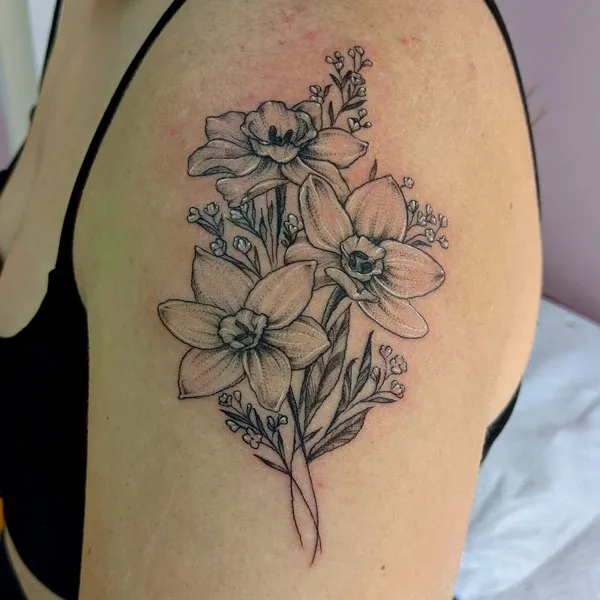 Arm December birth flower tattoo