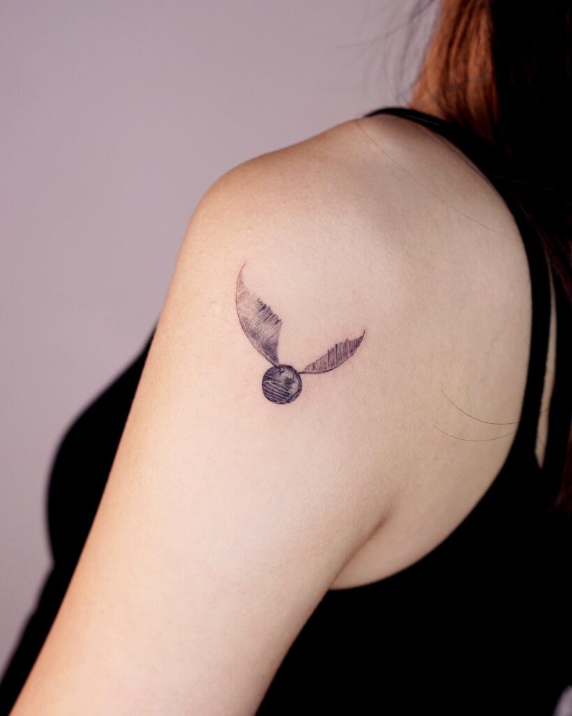 Arm and shoulder magic the golden snitch tattoo design