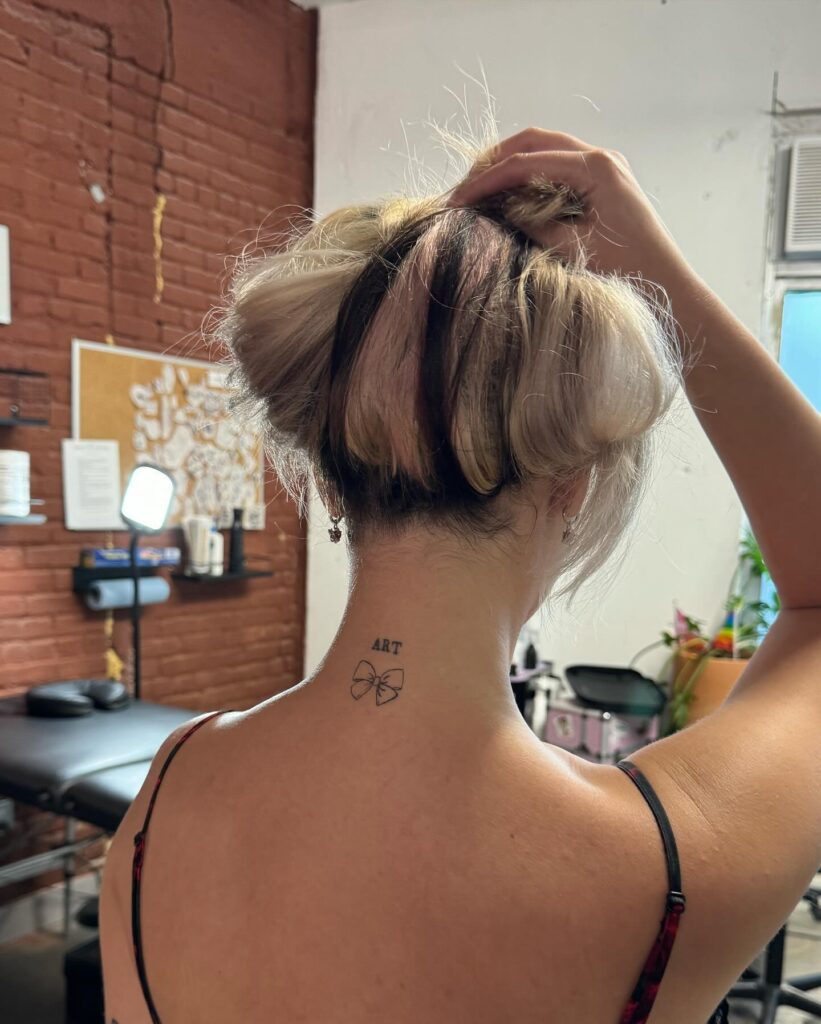 'Art' Word with Ribbon Bow on the Back of the Neck: Artistic Flourish