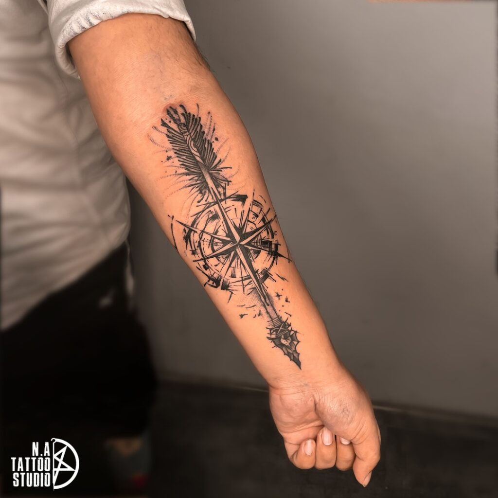 Artistic direction abstract arrow & compass forearm tattoo
