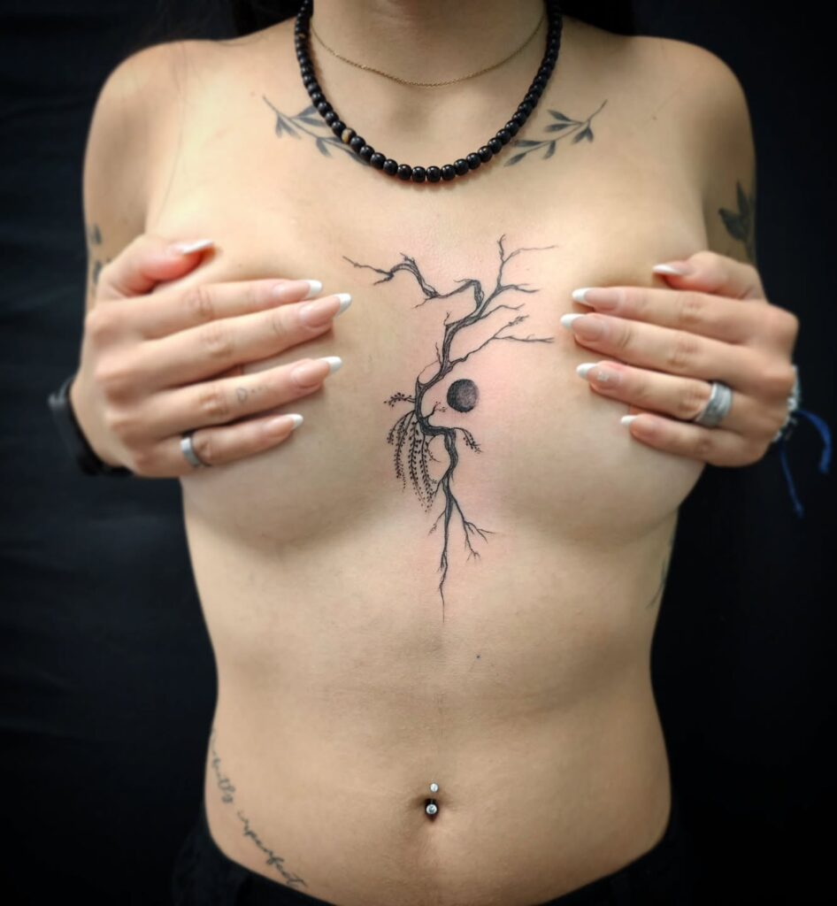 Artistic tree sternum tattoo symbolizing growth, resilience, and nature