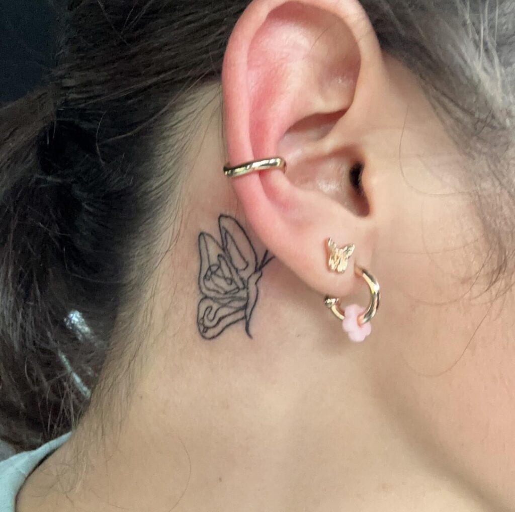 Awesome butterfly flapping tattoo behind the ear small youthful vibes