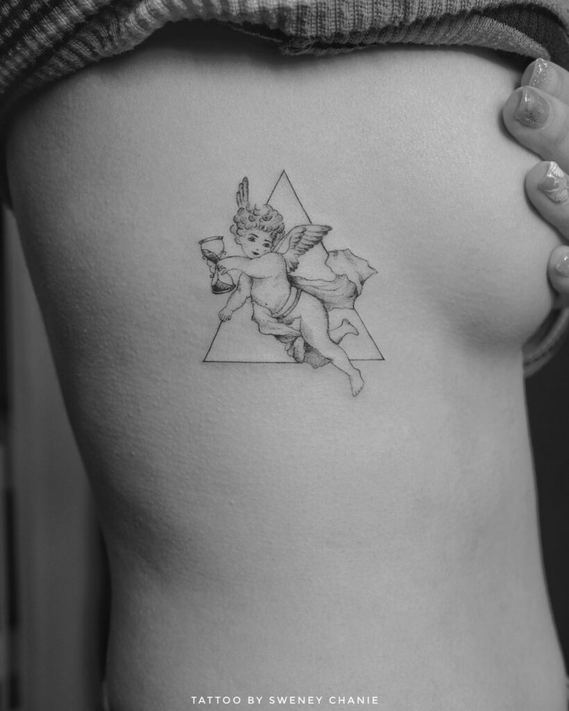 Baby Angel with Hourglass Finline Tattoo on the Rib: Timeless Innocence