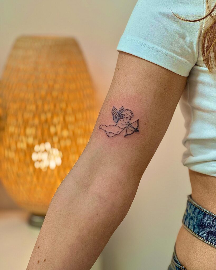 Baby Angel with Wings and Bow and Arrow Tattoo on the Above the Elbow: Heavenly Guardian