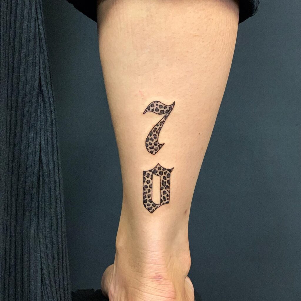 Back of the ankle tattoo vertical 70 digit inside leopard print