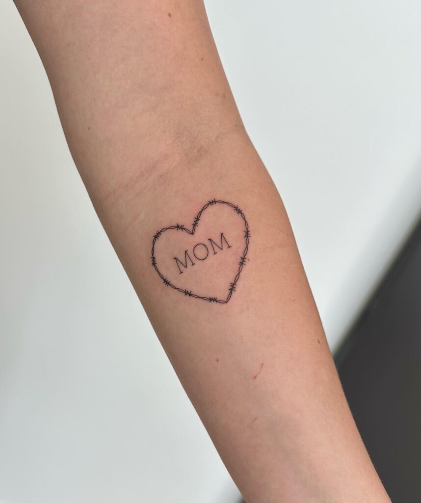 Barbed Wire Heart with 'Mom' Below the Elbow: Maternal Bond