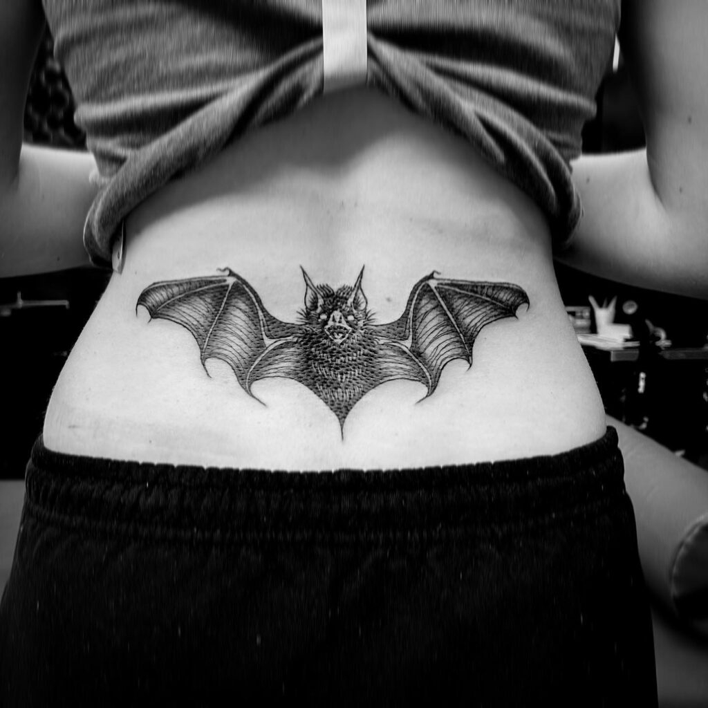 Bat Open Wings Tattoo, a Symbol of Mystery on the Lower Back: Nocturnal Elegance