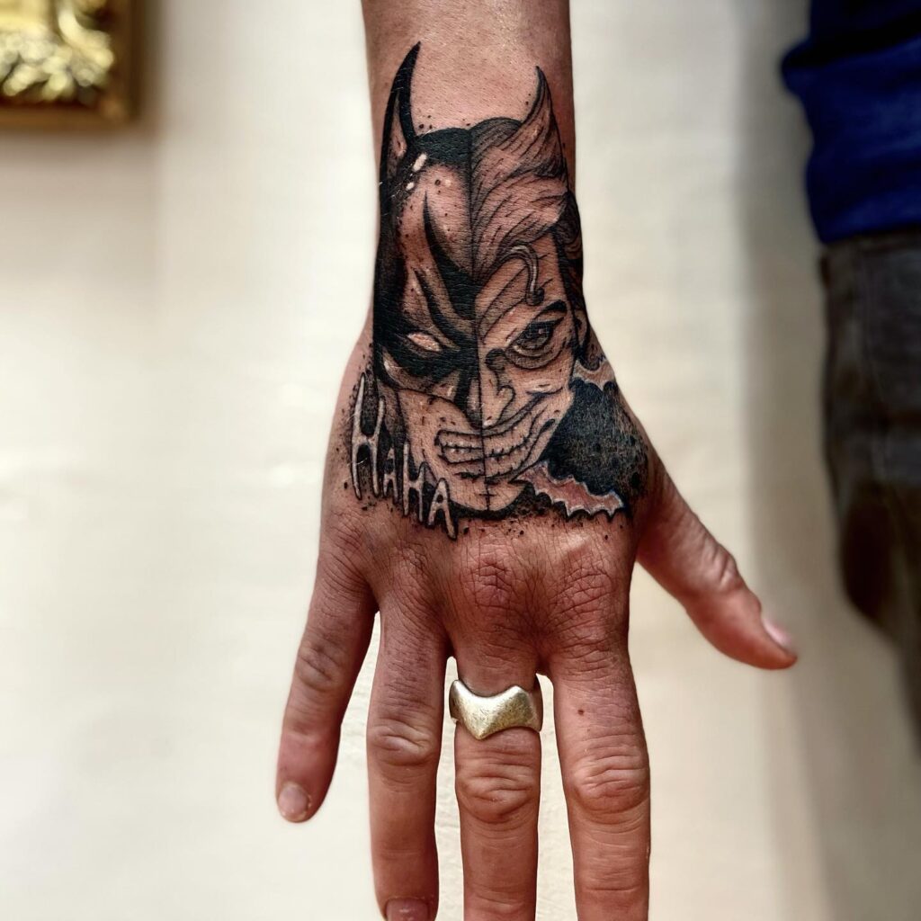 Batman/Joker Hand Cover-up Tattoo with "Hahaha" Text