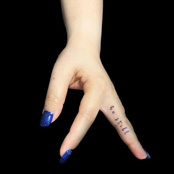 Be still finger tattoo