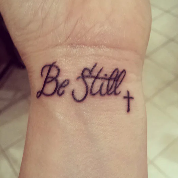 Be still tattoo with cross