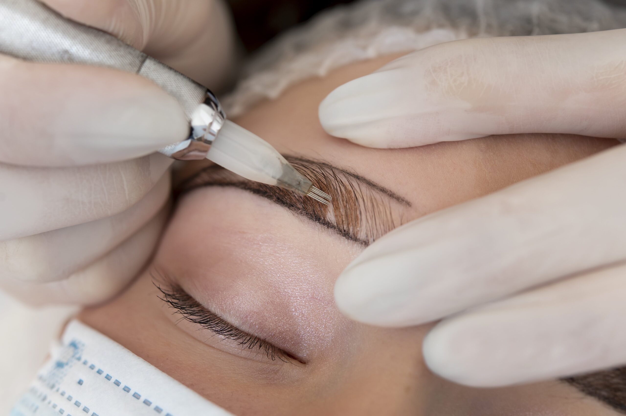 Beautician Working on a Client's Eyebrows Ombre Brows