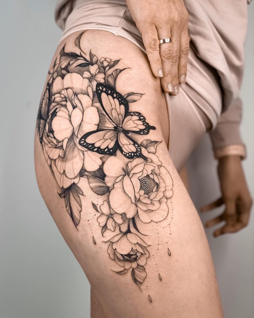 Beautiful Thigh tattoos with butterflies and flowers on the thigh