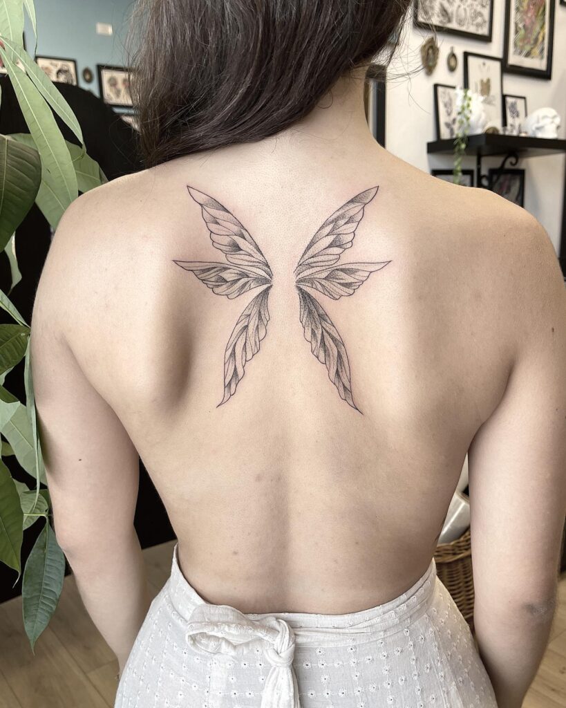 Beautiful and Clean Fairy Wing Tattoo on the Back: Fairy Whispers