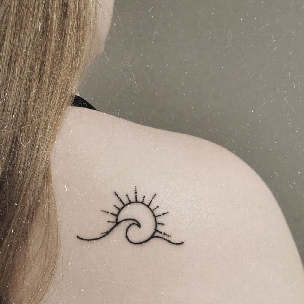 Beautiful Small Wave And Sun Tattoo For The Back