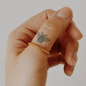 Bee finger tattoo 1