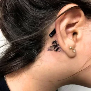 Bee tattoo behind ear 1