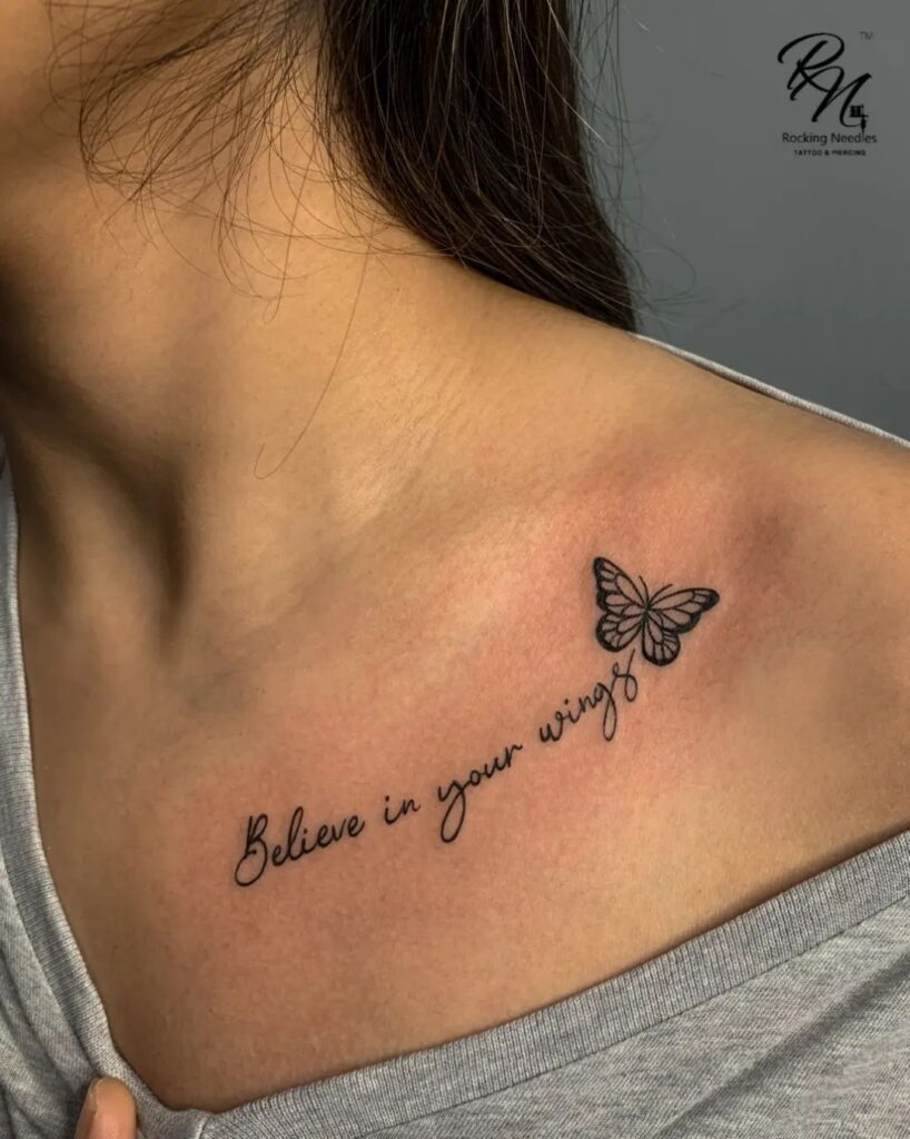 'believe in your wings' lettering collarbone tattoo with a beautiful butterfly, a motivational and artistic piece winged belief