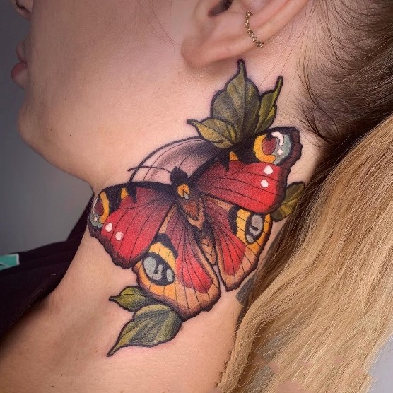 Big bold butterfly tattoo design behind the ear