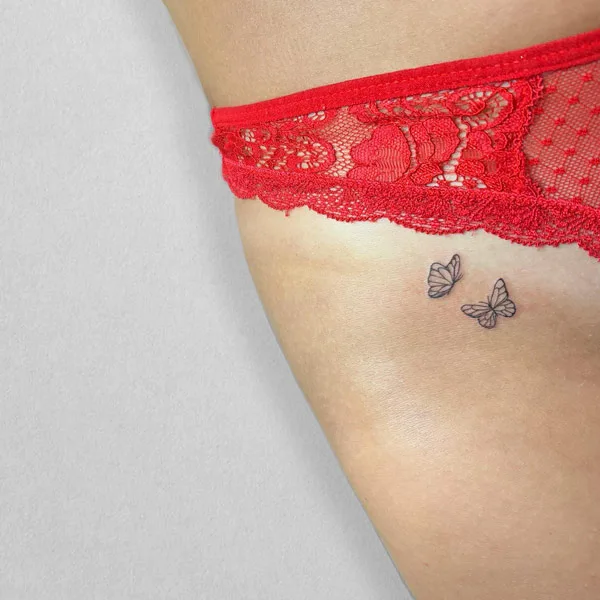 Bikini line butterfly tattoo