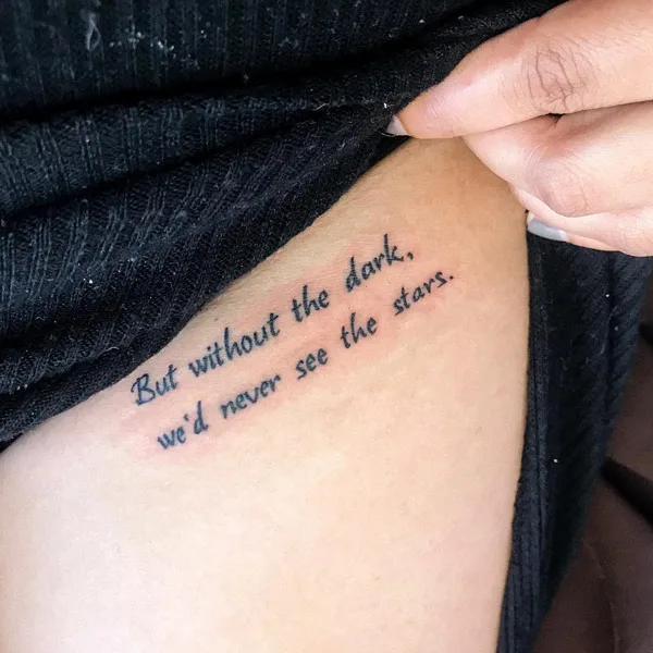Bikini line script tattoo