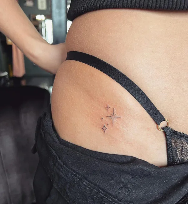 Bikini line sparkle tattoo