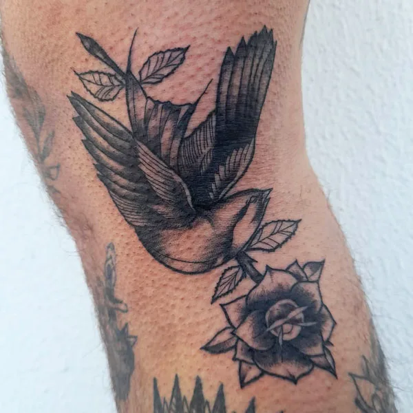 Bird December birth flower tattoo