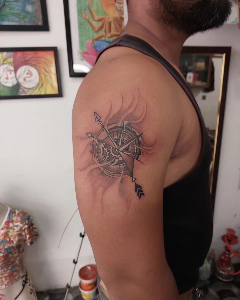 Black and Brown Compass Tattoo on the Upper Arm for a Grounded Look: Earthy Navigator