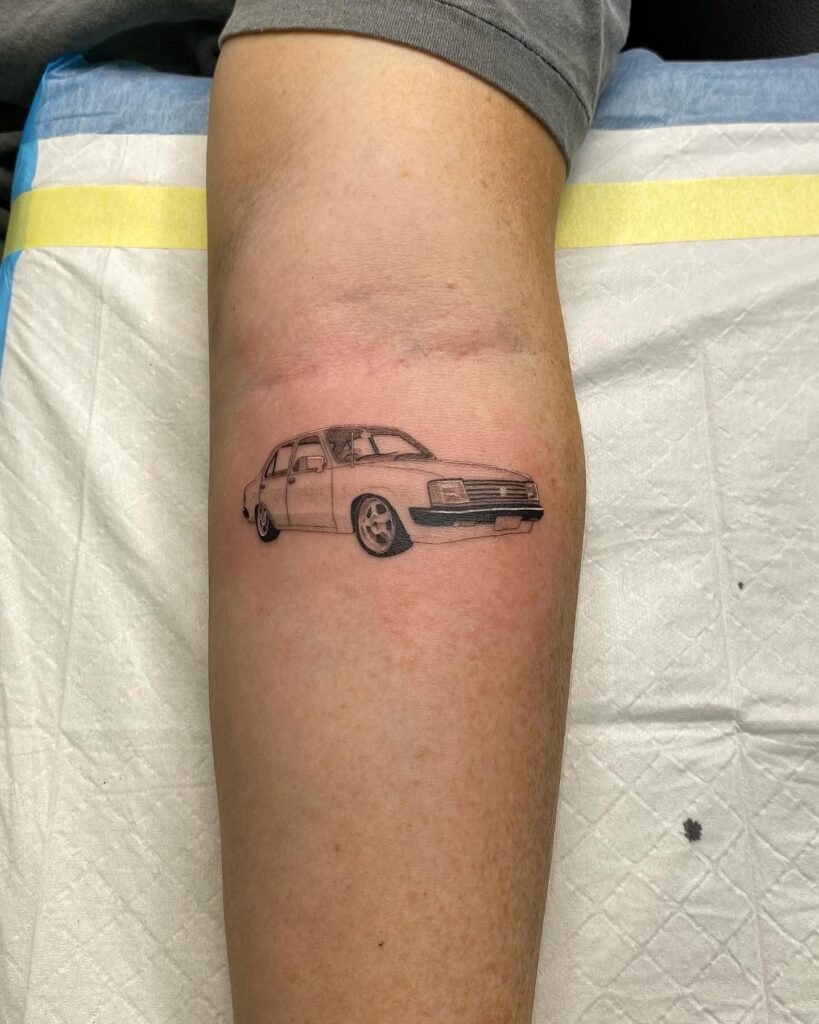 Black and Gray Holden Torana Tattoo on Forearm, Symbolizing Classic Australian Muscle Cars – Car Tattoo Ideas