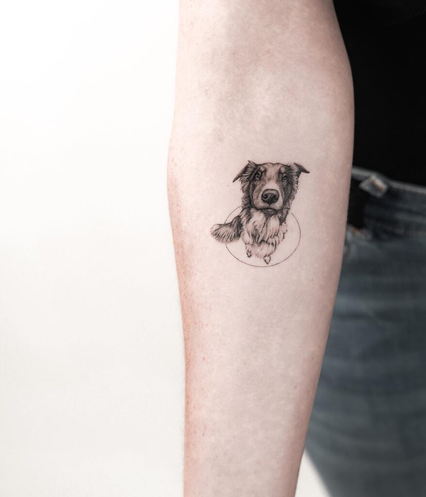 Black and Grey Dog Portrait Tattoo Gracefully on the Forearm: Canine Companionship