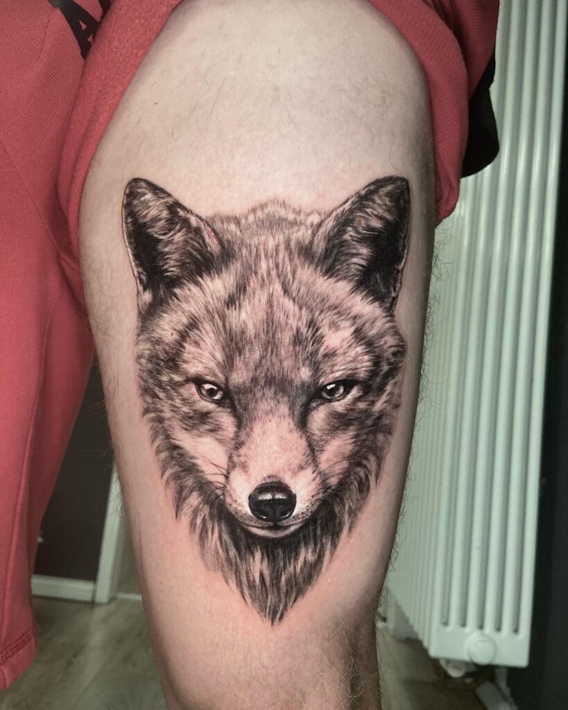 Black and Grey Realistic Fox Face Tattoo on the Thigh: Realism Unveiled