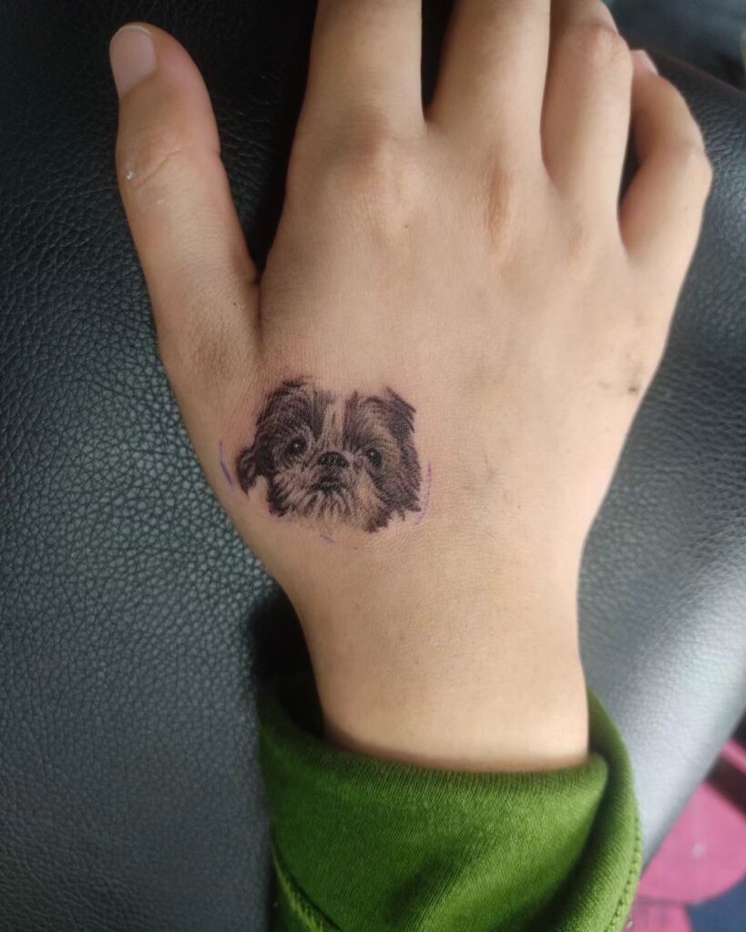 Black and Grey Shaded Small Shih Tzu Face Tattoo on the Outer Hand: Shih Tzu Chic