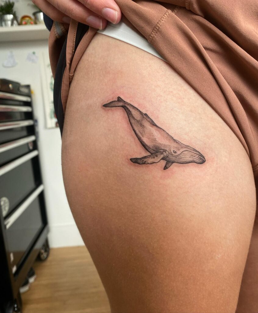 Black and Grey Whale Tattoo on the Hip: Oceanic Majesty, a Majestic Marine Presence