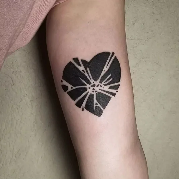 Black broken heart tattoo