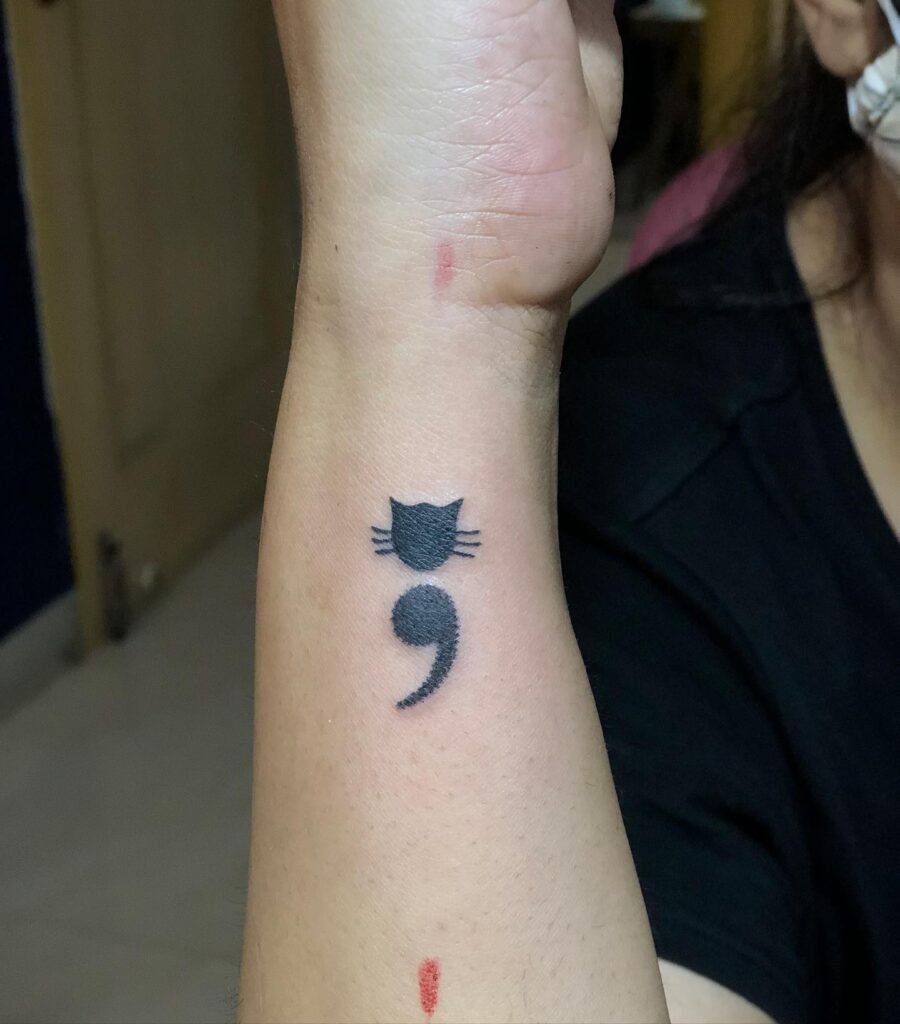 Black Cat Semicolon Tattoo on the Side of the Wrist: Whisker Whispers