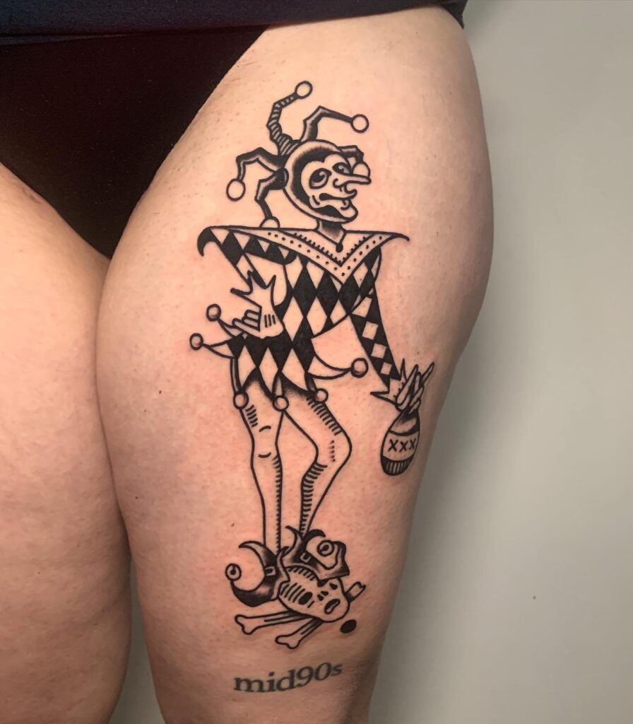 Black Drunky Joker from the Mid 90's Tattoo on Thigh: Vintage and Unique Tattoo Art