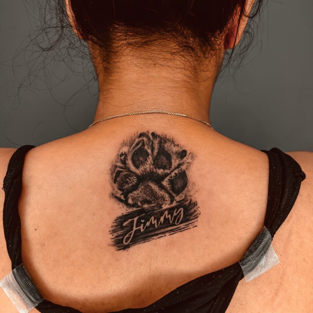 Black Ink Dog Paw Print with 'Jimmy' Lettering on the Back of the Neck: Jimmy's Tribute