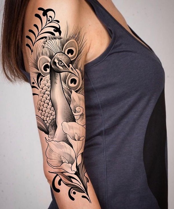 Black Peacock Feather Tattoo on Hand