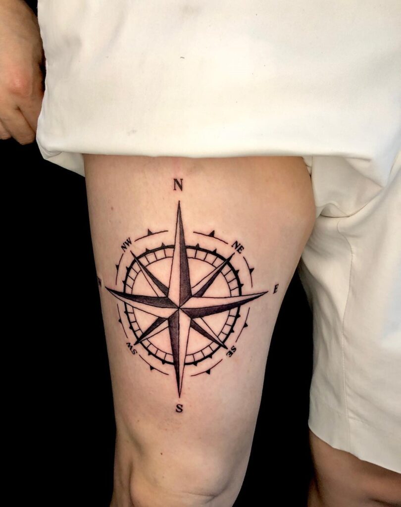 Black Work Compass Tattoo on the Thigh for a Nautical Adventure: Thigh Expedition