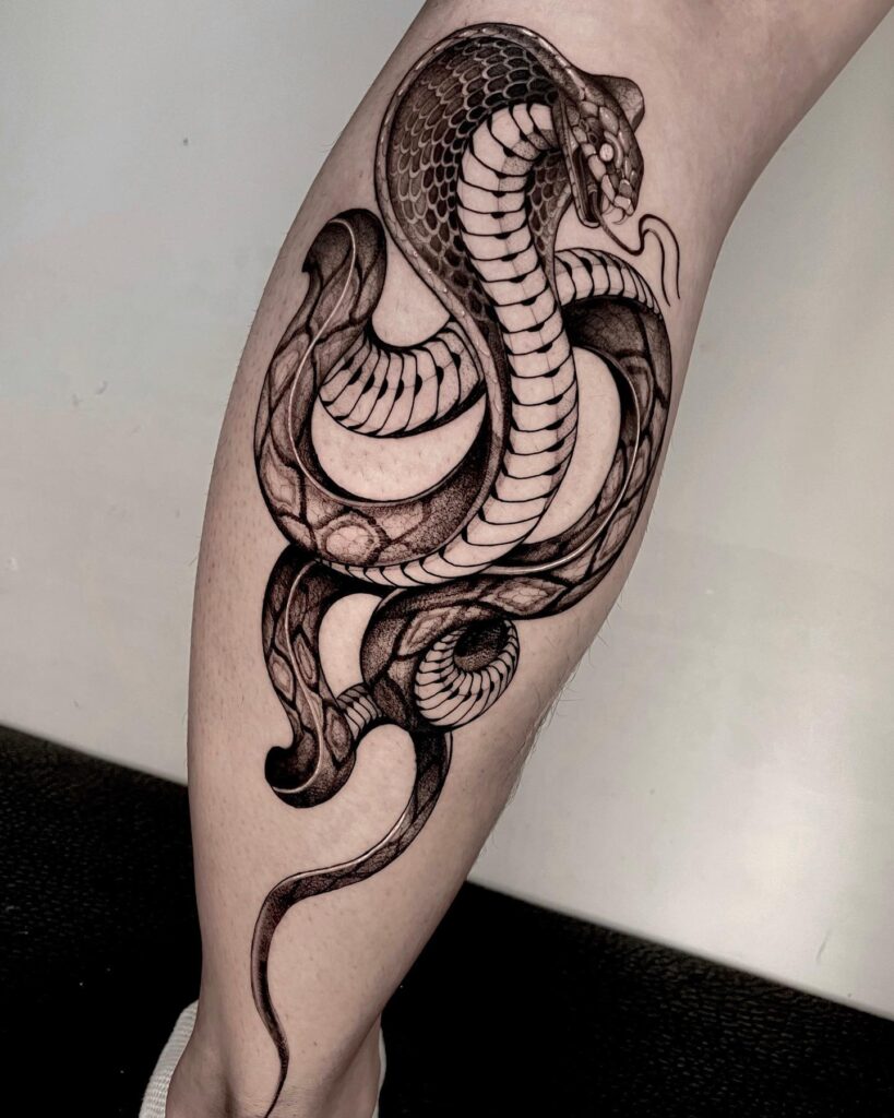 Black work neo-traditional tattoo on the calf, angry head up and tongue out: roaring rebellion