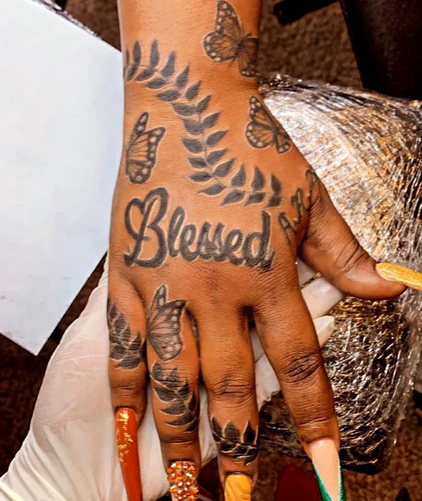 Blessed butterfly hand tattoo
