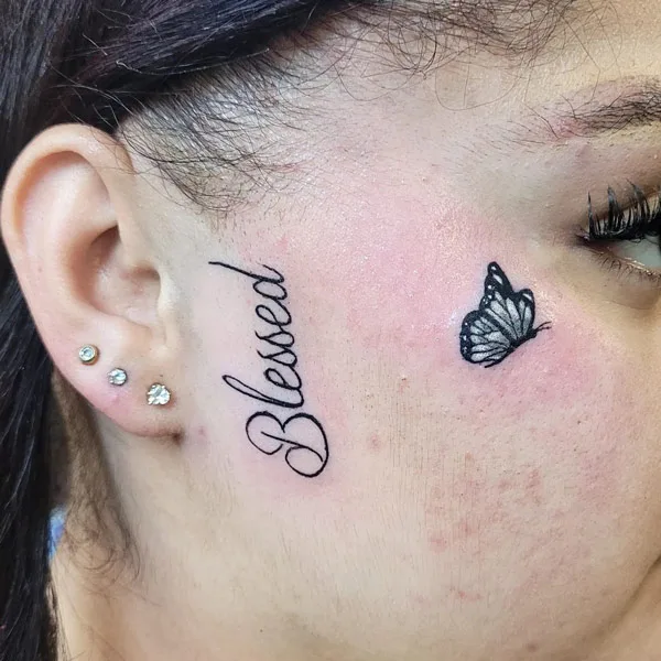Blessed face tattoo
