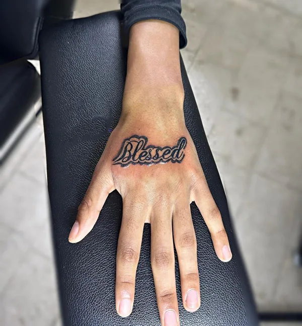 Blessed tattoo on hand