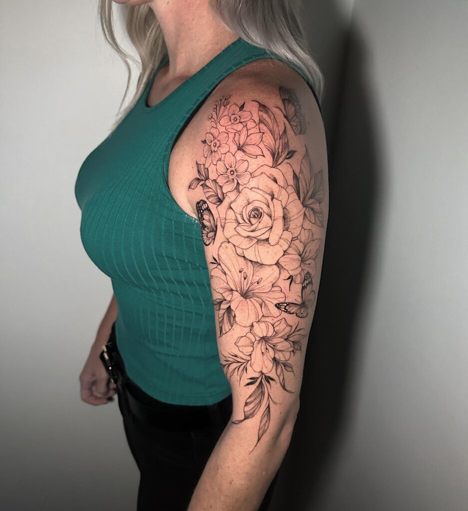 Blossoming beauty rose and butterfly half sleeve tattoo for women