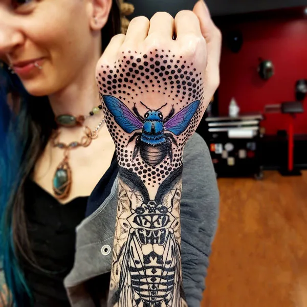 Blue bee tattoo