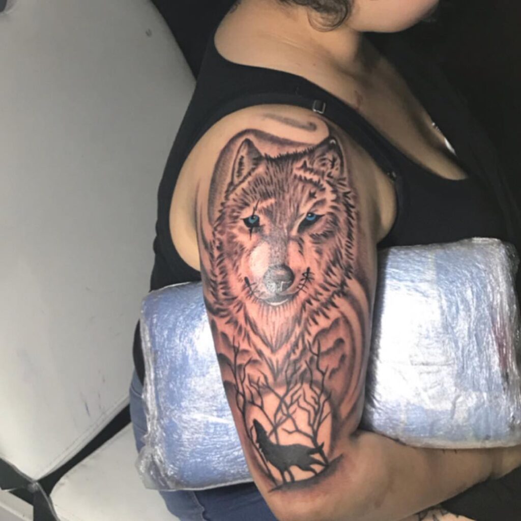 Blue-Eyed Howling Wolf Half Sleeve Tattoo: A Stunning Choice for Women